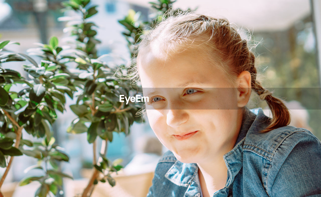 portrait, one person, headshot, childhood, child, spring, smiling, nature, portrait photography, plant, flower, looking at camera, person, happiness, women, growth, emotion, tree, day, food and drink, outdoors, casual clothing, lifestyles, female, food, leaf, looking, plant part, front view, leisure activity, agriculture, blond hair, hairstyle, close-up, gardening, human face, adult