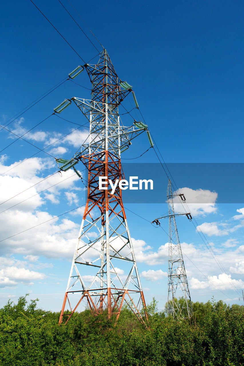 Low angle view of electricity pylon against sky