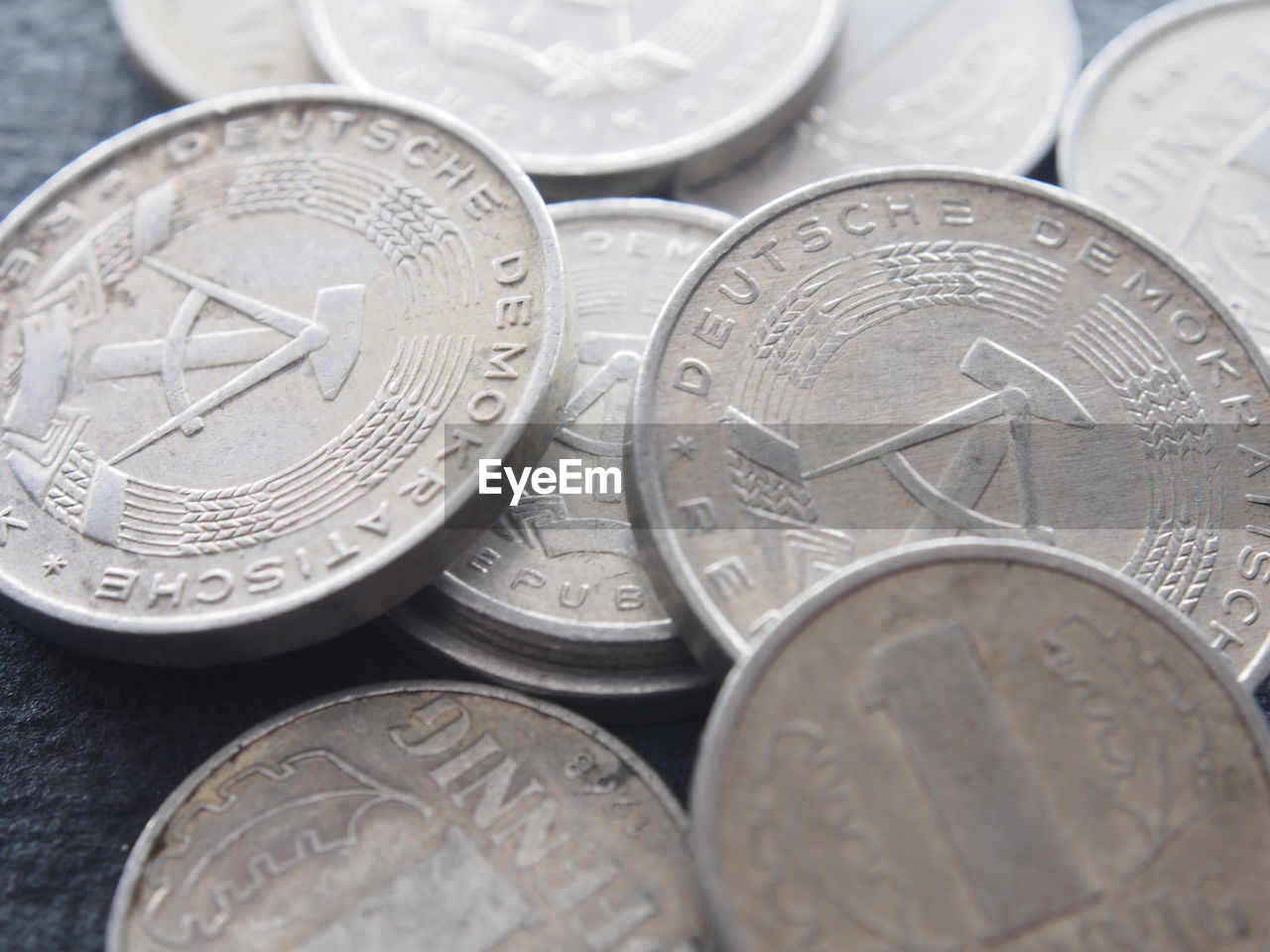 CLOSE-UP OF COINS ON TABLE