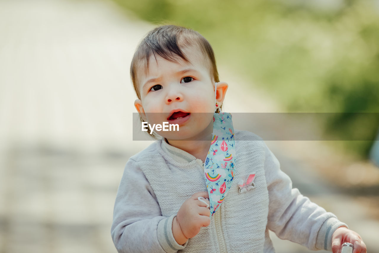 PORTRAIT OF CUTE BOY LOOKING AWAY