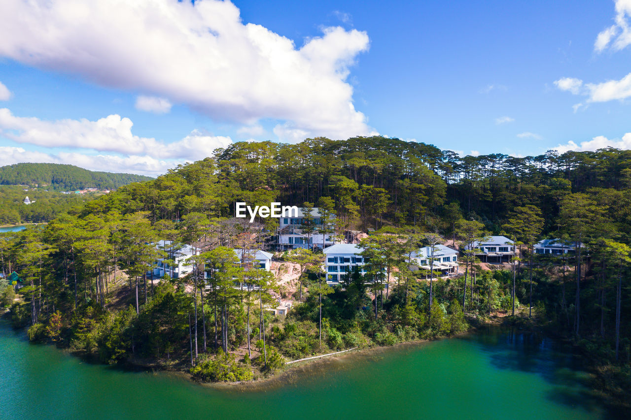 water, sky, land, nature, tree, architecture, environment, landscape, building, cloud, scenics - nature, plant, building exterior, house, mountain, built structure, travel destinations, beauty in nature, travel, sea, body of water, city, blue, beach, residential district, forest, tourism, no people, summer, reflection, village, tranquility, vacation, trip, outdoors, coastline, holiday, day, mountain range, idyllic, social issues, tranquil scene, island, pinaceae, town, nautical vessel, lagoon, pine tree, aerial photography, rural scene, coniferous tree, tourist resort, coast, sunlight, environmental conservation, pine woodland, transportation, tropical climate, green
