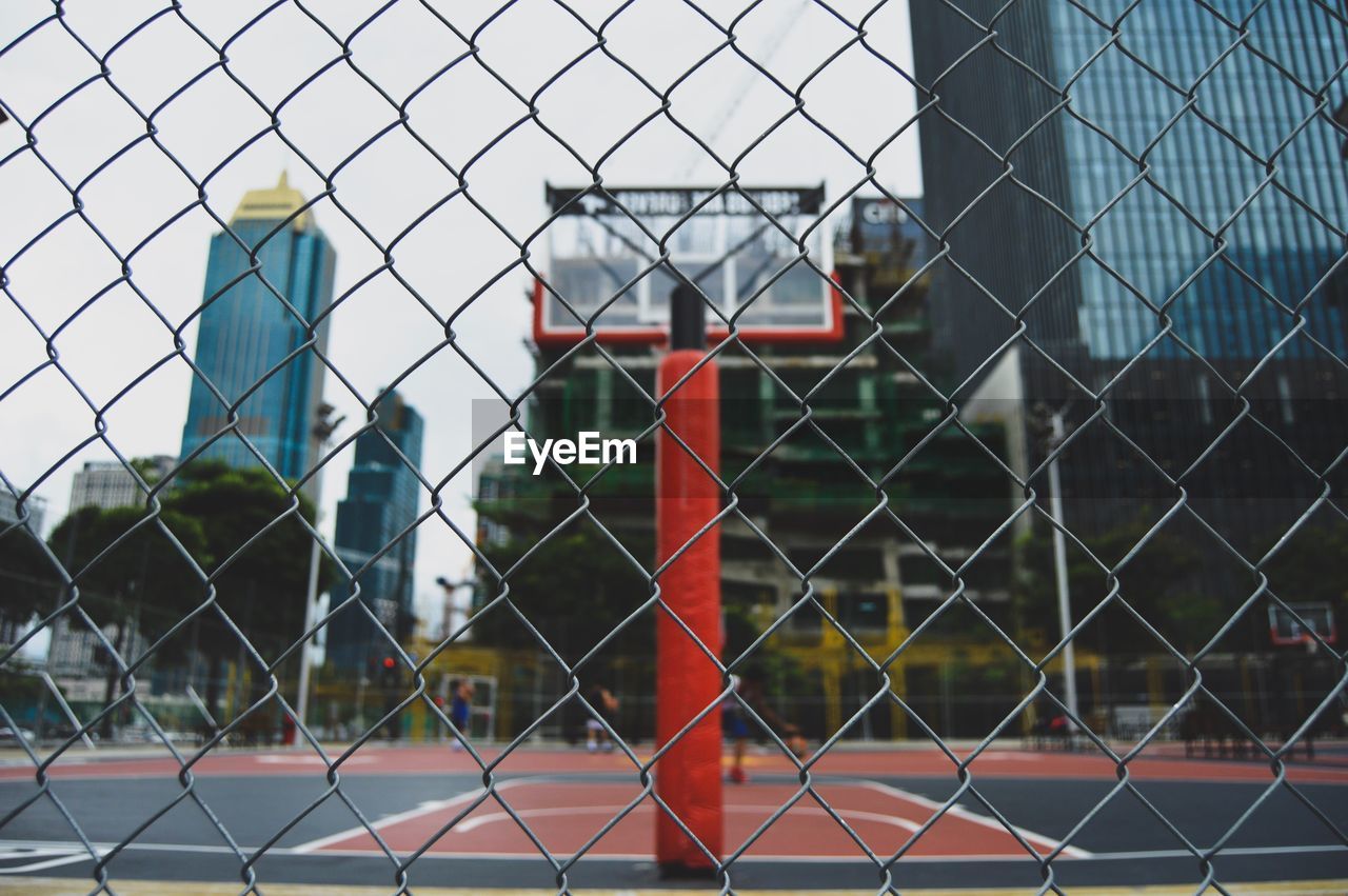 Close-up of chainlink fence against sky