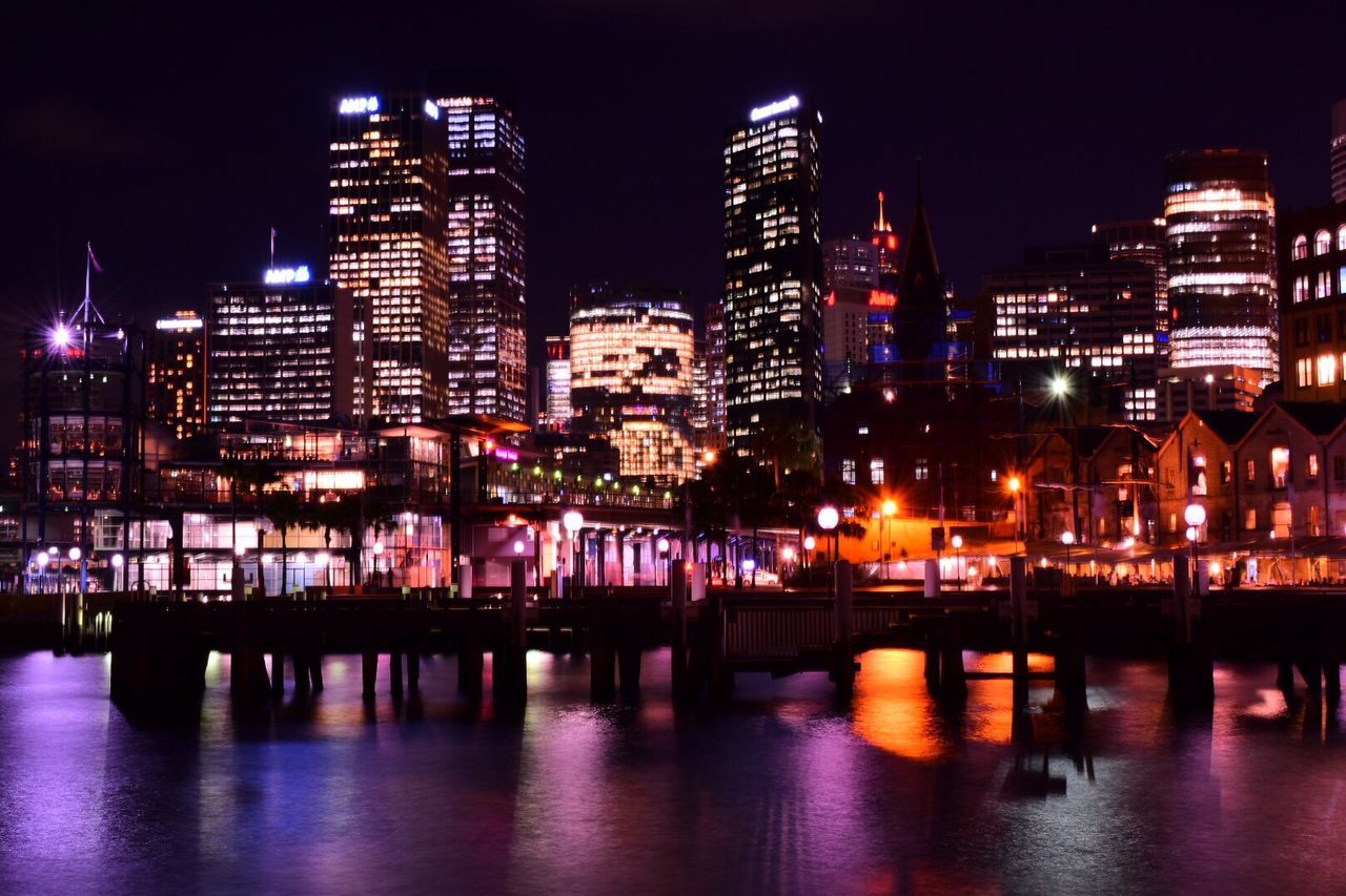 ILLUMINATED CITYSCAPE AT NIGHT