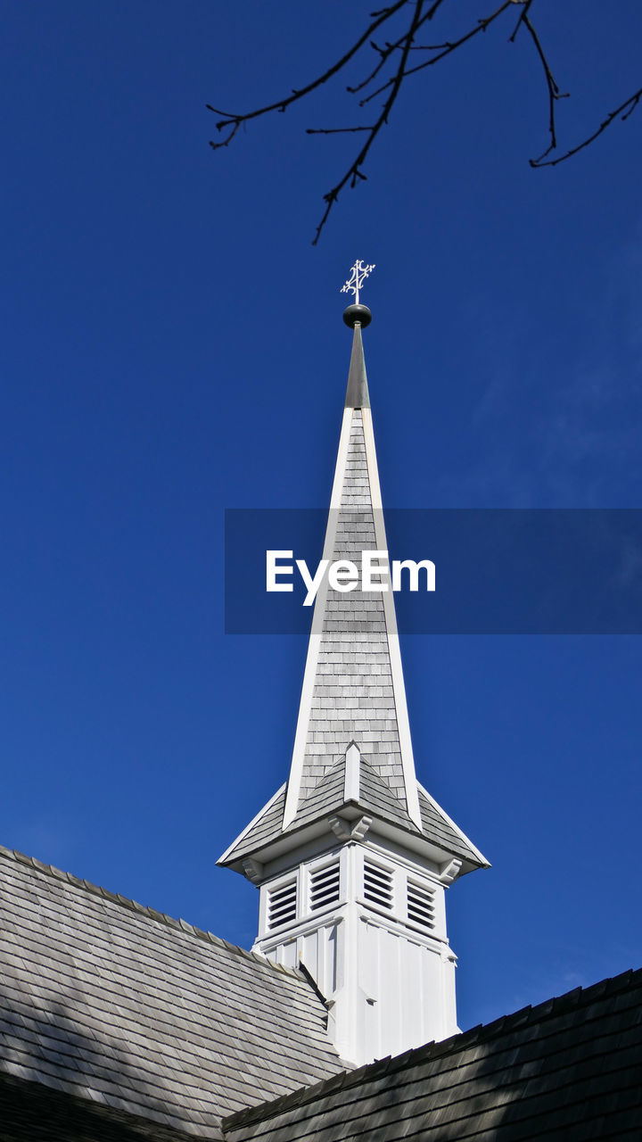 Low angle view of building against blue sky