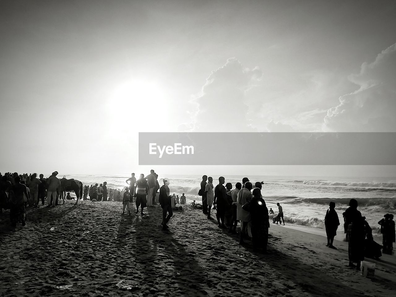 PEOPLE AT BEACH DURING SUNSET