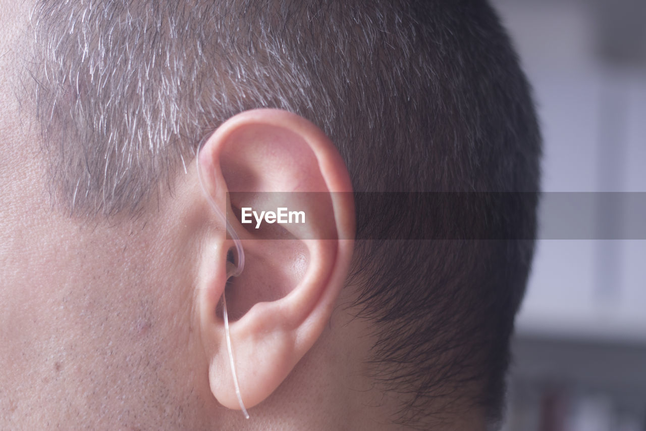 Close-up of man wearing hearing aid