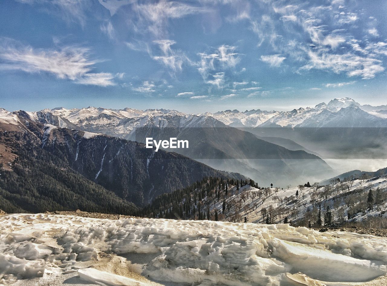 Scenic view of snow covered mountain ranges