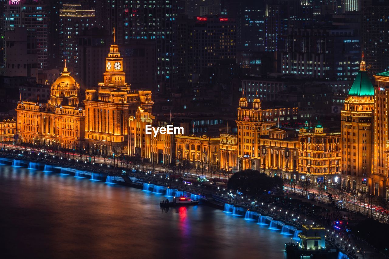 Illuminated buildings in city at night