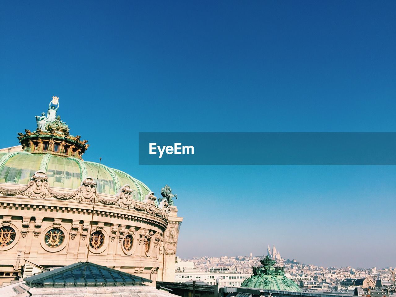 Paris rooftops on a perfect sunny day, panoramic city view from the city center to montmartre