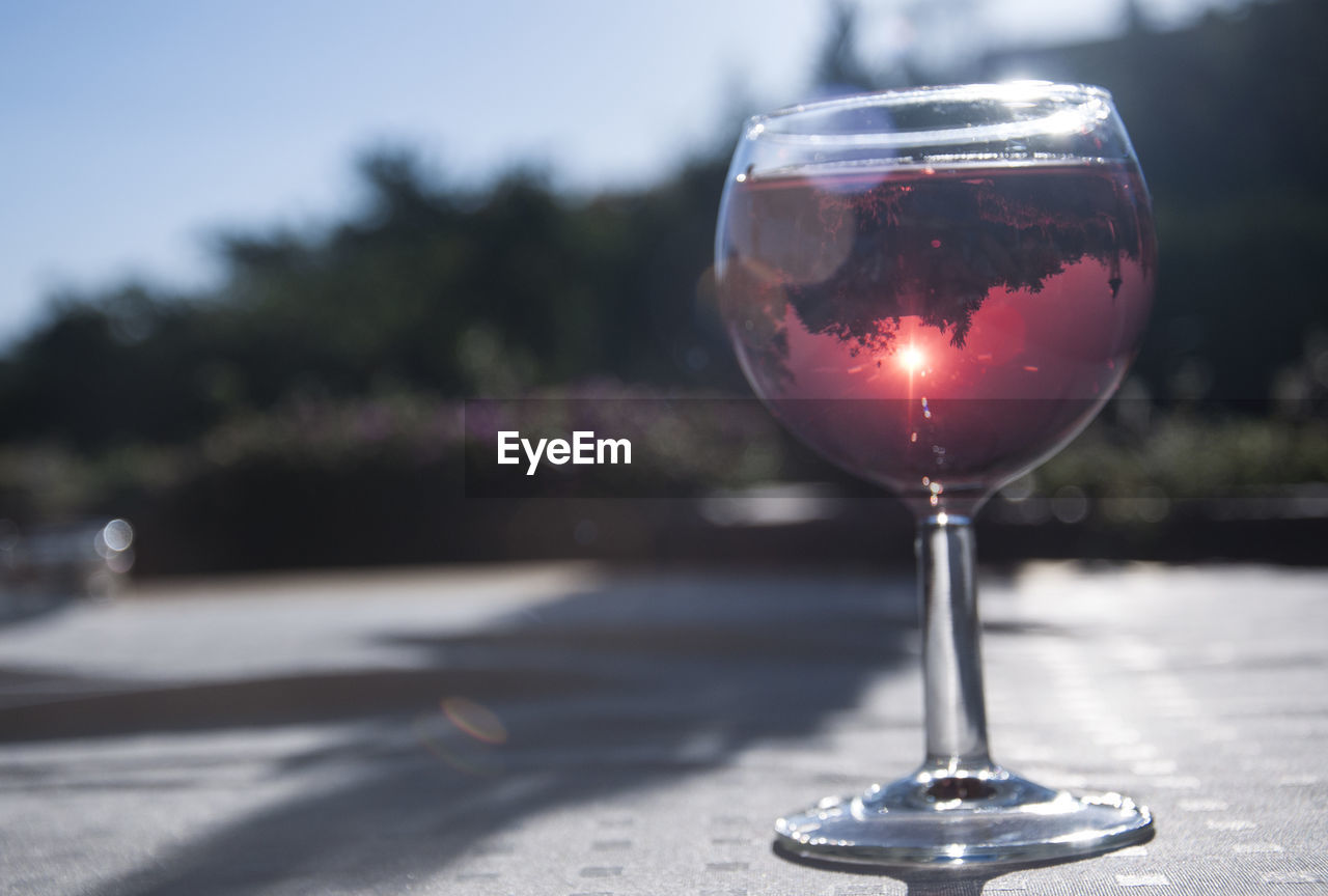 Close-up of wineglass on table