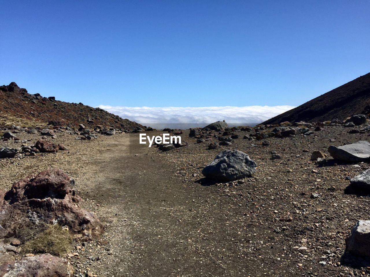 BARREN LANDSCAPE AGAINST CLEAR BLUE SKY