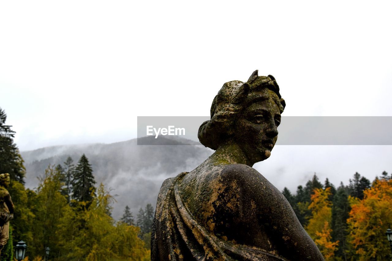 Low angle view of statue against sky