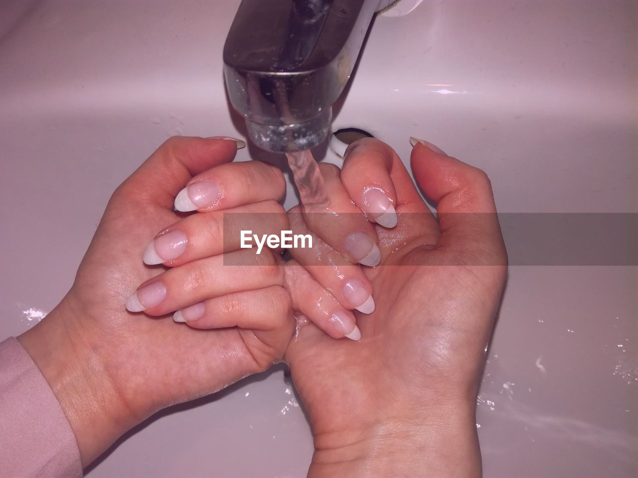 Close-up of hand washing hands