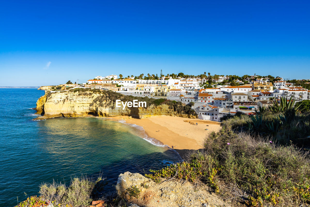 View of carvoeiro, a pretty holiday village with a beautiful sandy beach, algarve, portugal