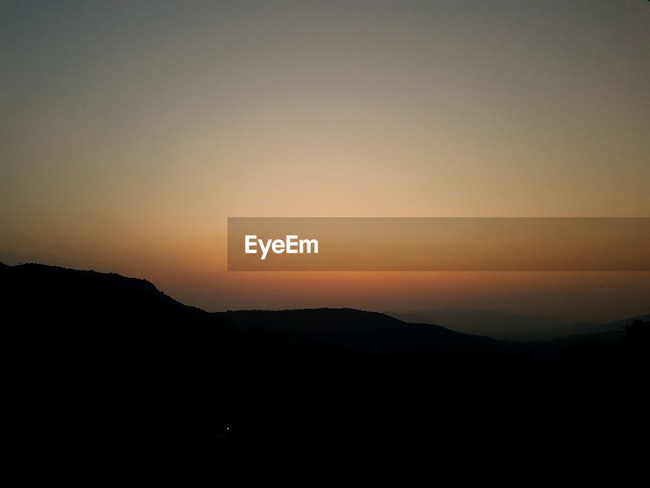 SILHOUETTE MOUNTAINS AGAINST SKY DURING SUNSET