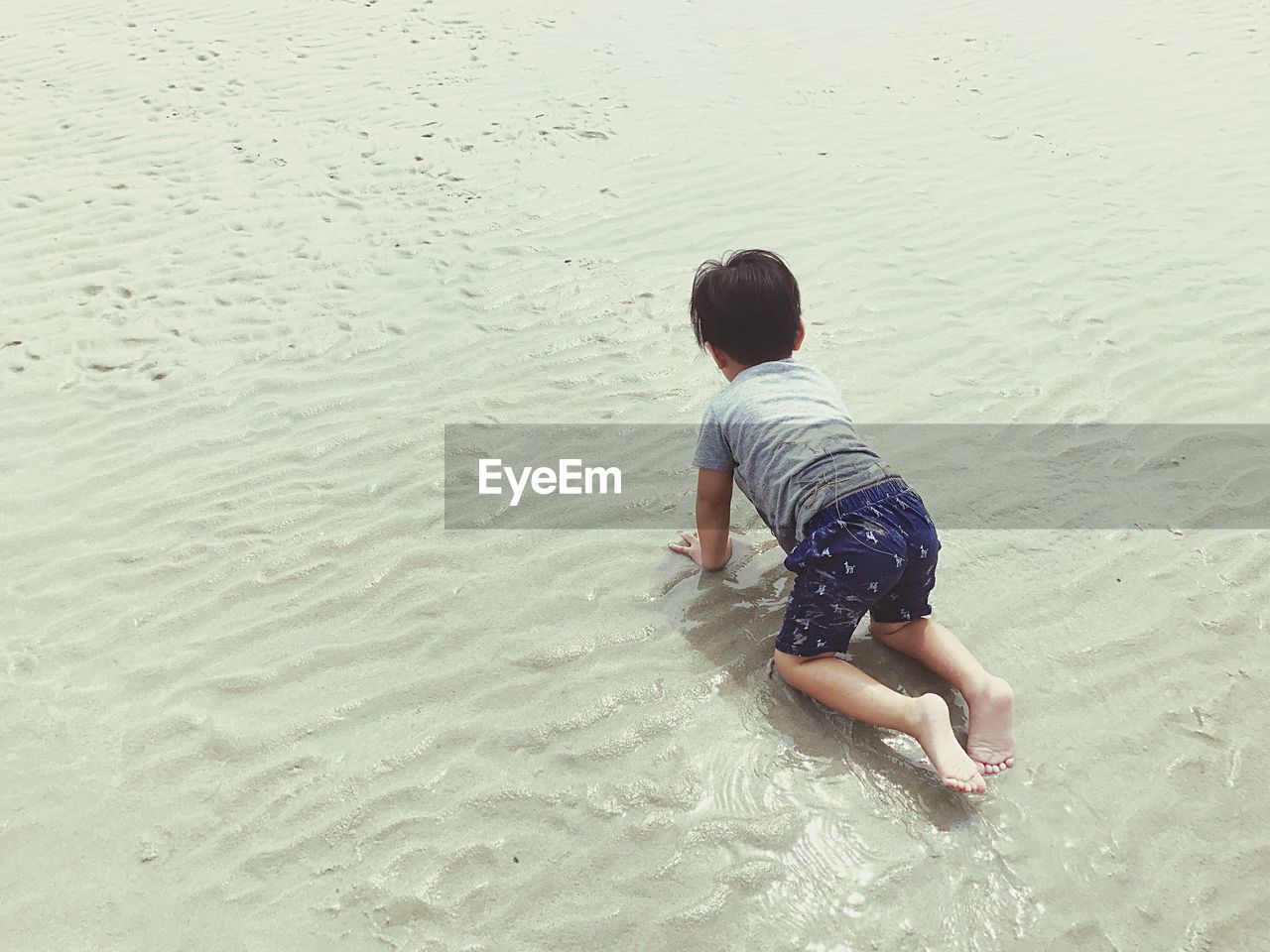 Boy playing on beach