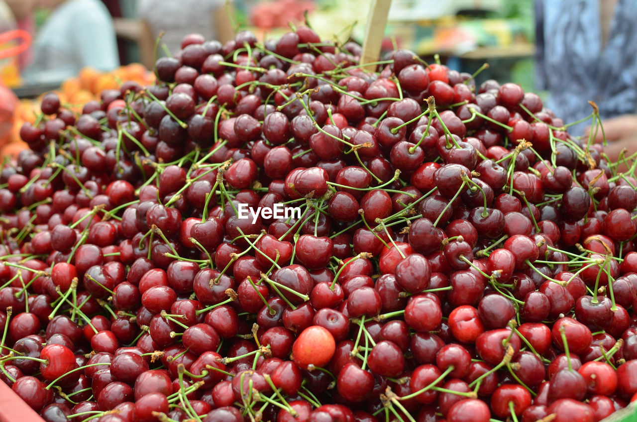 Ripe cherries on green market desk in spring