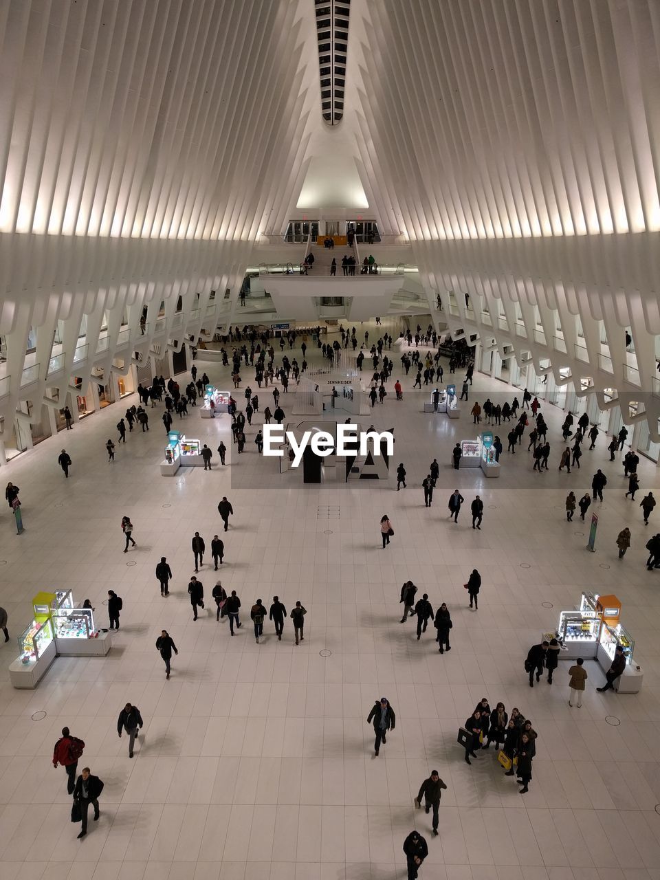 HIGH ANGLE VIEW OF PEOPLE IN MODERN OFFICE