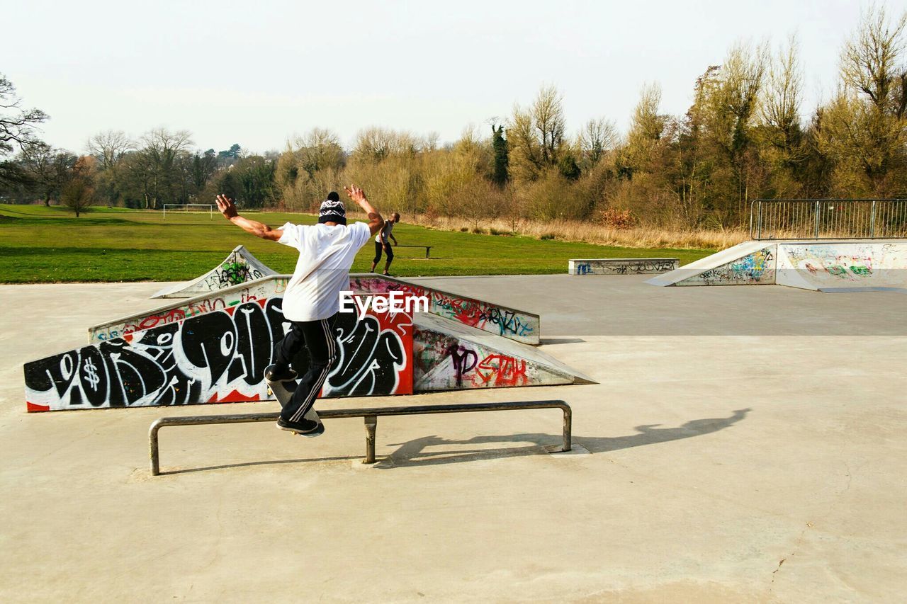 Rear view of person skateboarding