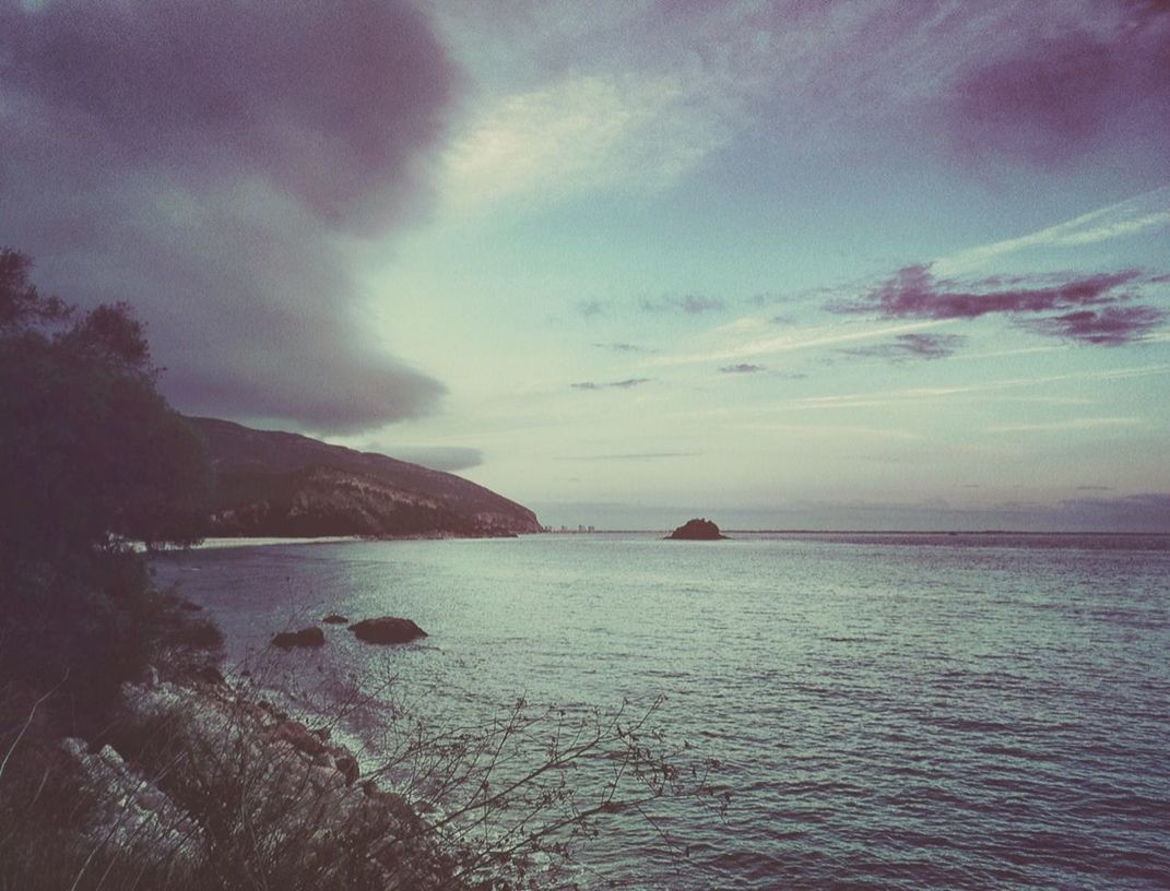 VIEW OF SEA AGAINST CLOUDY SKY