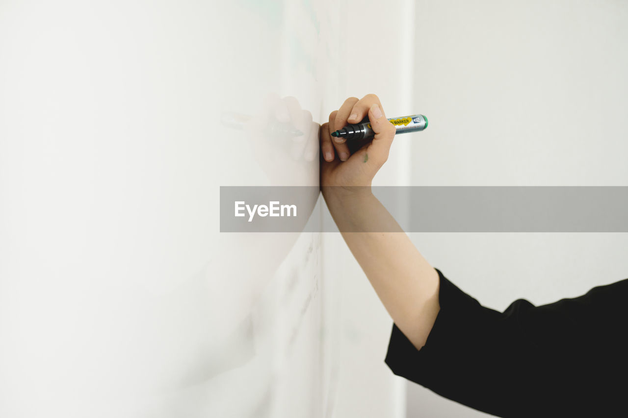 Hand writing on whiteboard