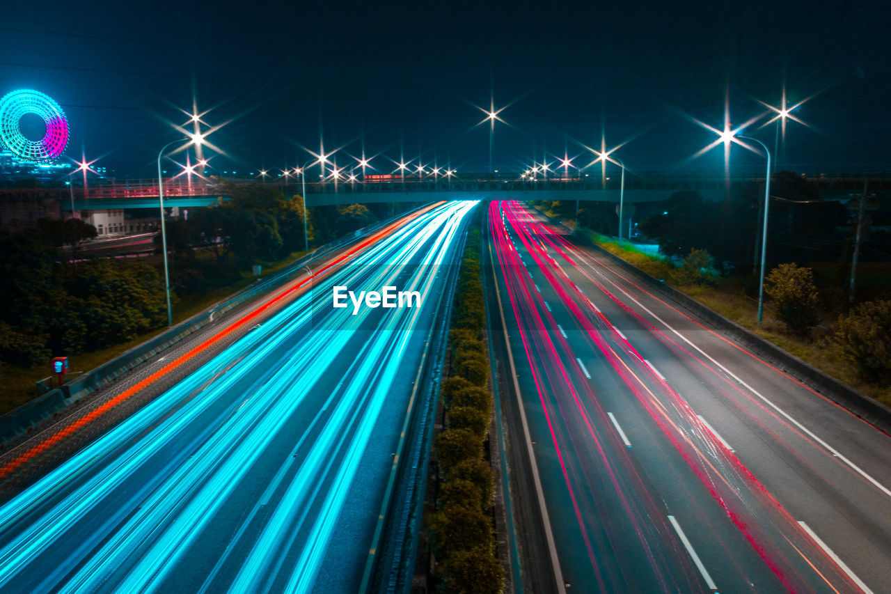 High angel view of light trails on highway at night