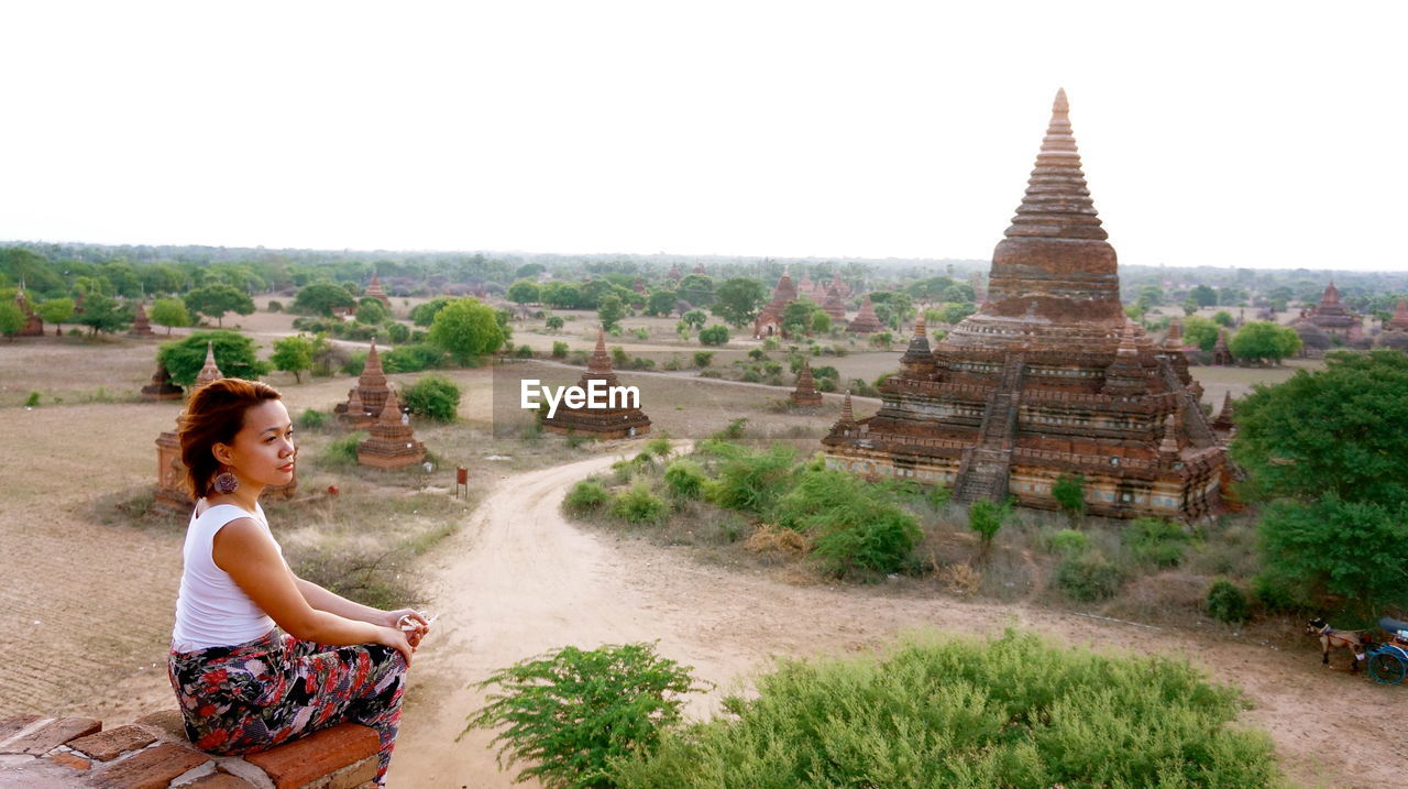 Woman sitting at temple