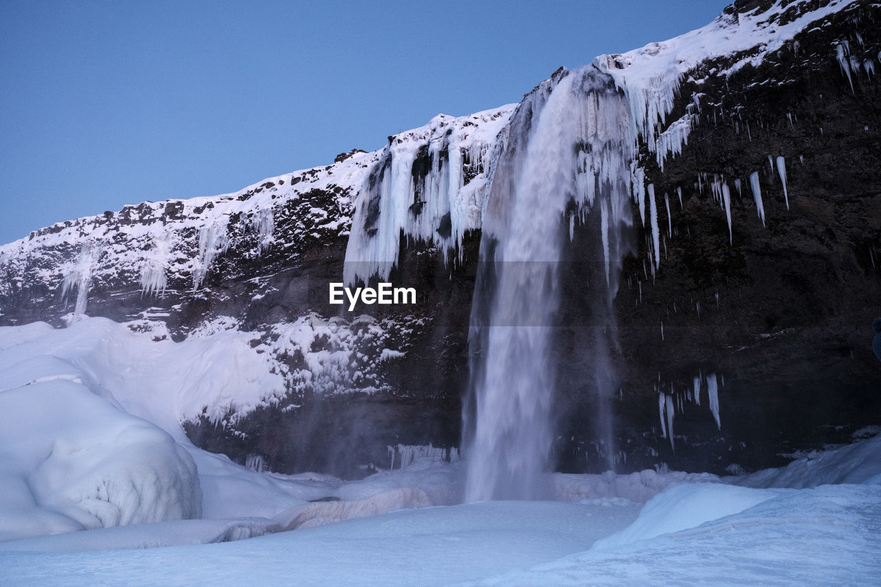 Seljalandfoss waterfall in winter landscape, iceland