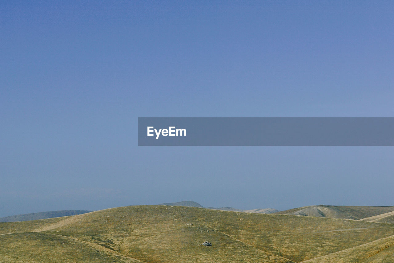 Scenic view of mountains against clear sky