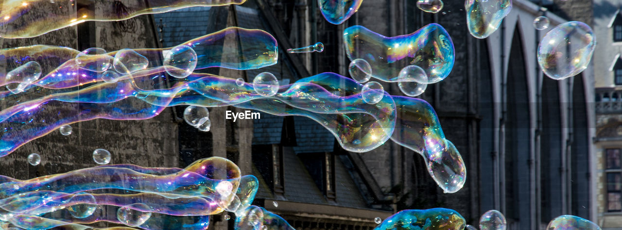 CLOSE-UP OF COLORFUL BUBBLES