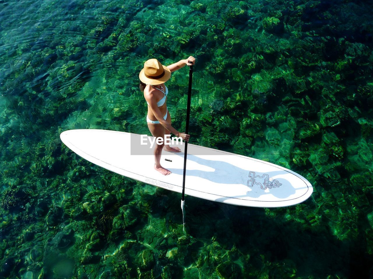 WOMAN STANDING IN BOAT