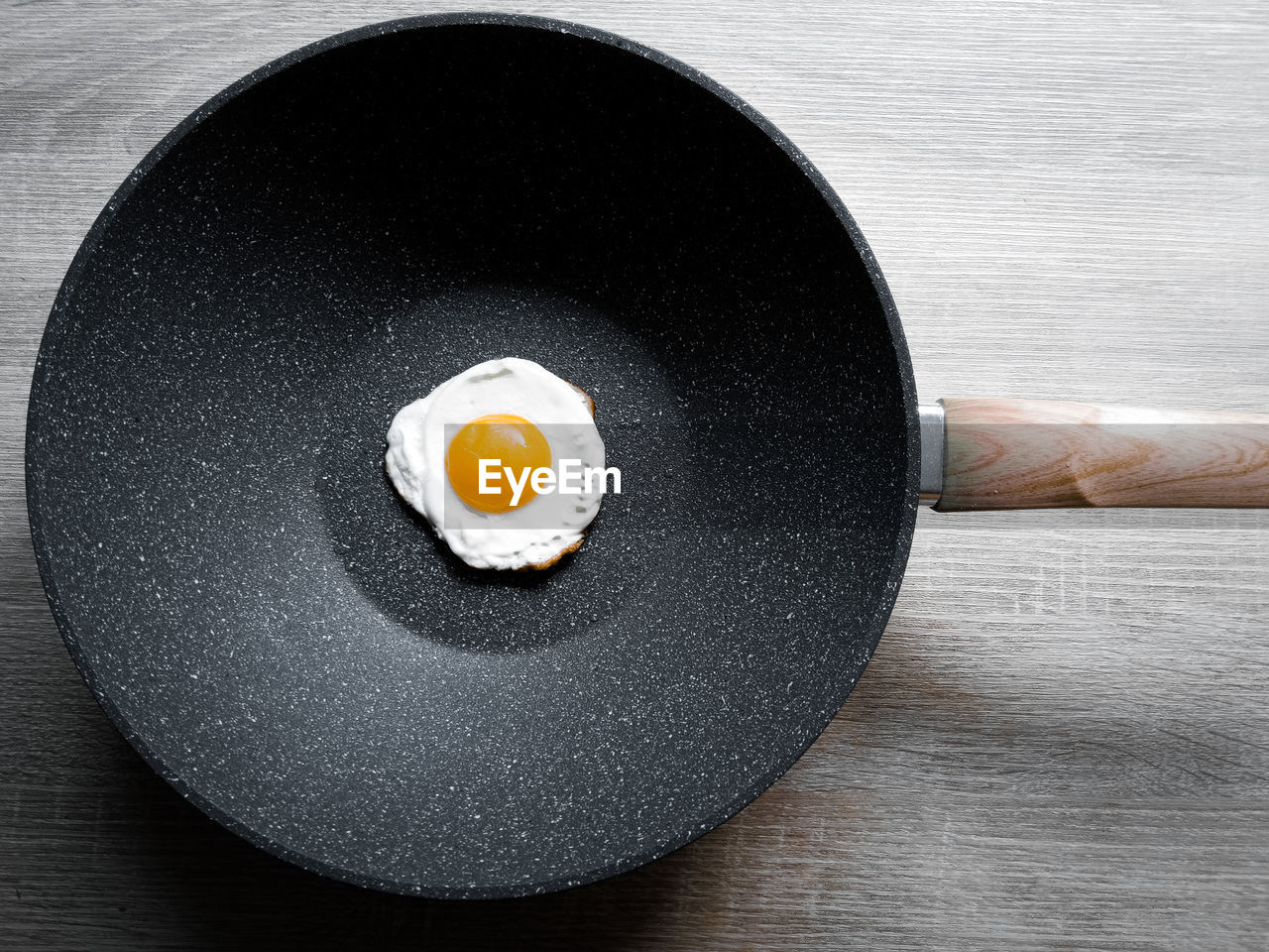 Fried eggs on a hot pan in the morning first meal of the day