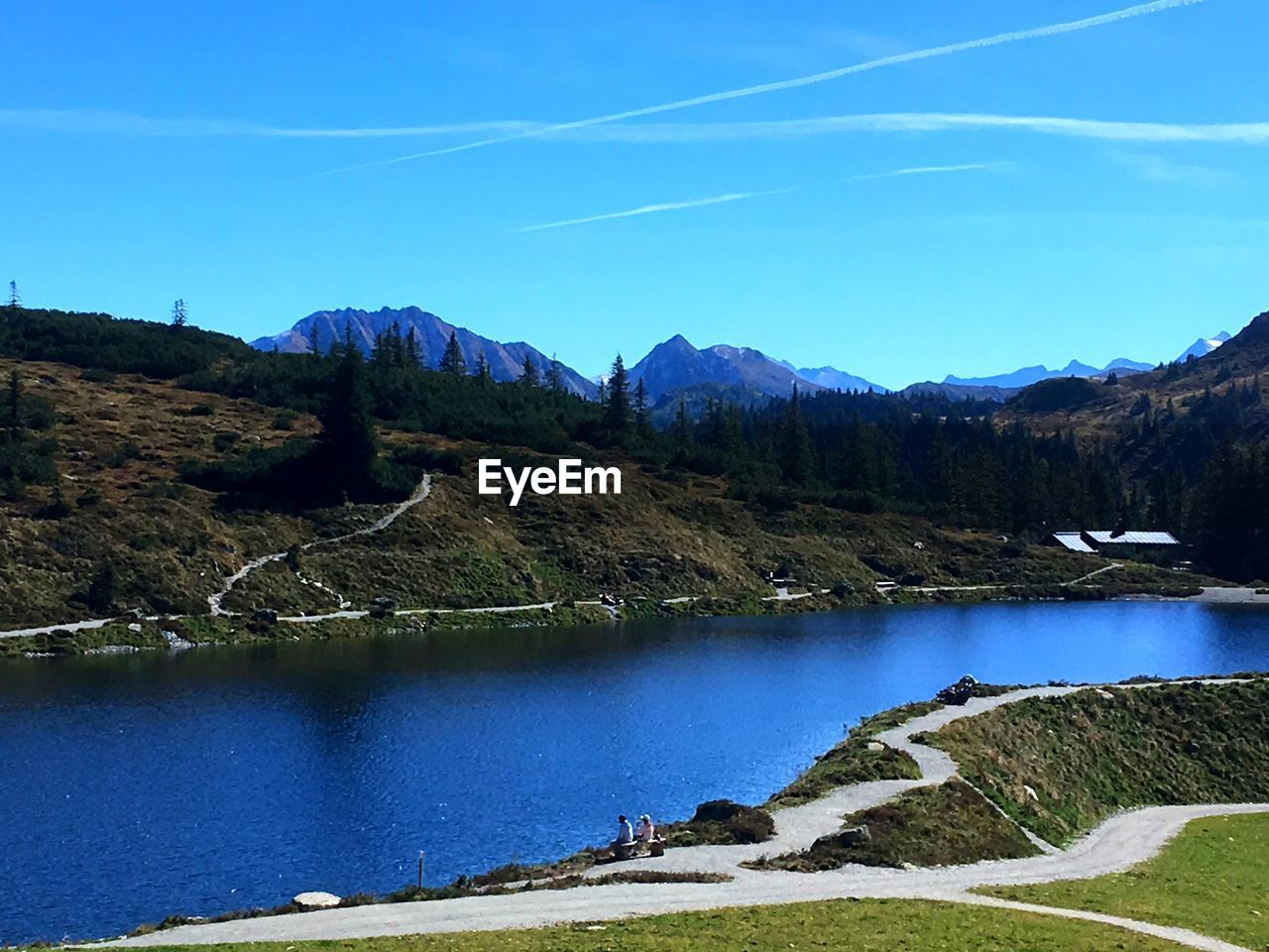 SCENIC VIEW OF LAKE AGAINST BLUE SKY