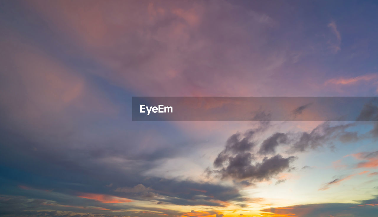 low angle view of cloudy sky during sunset