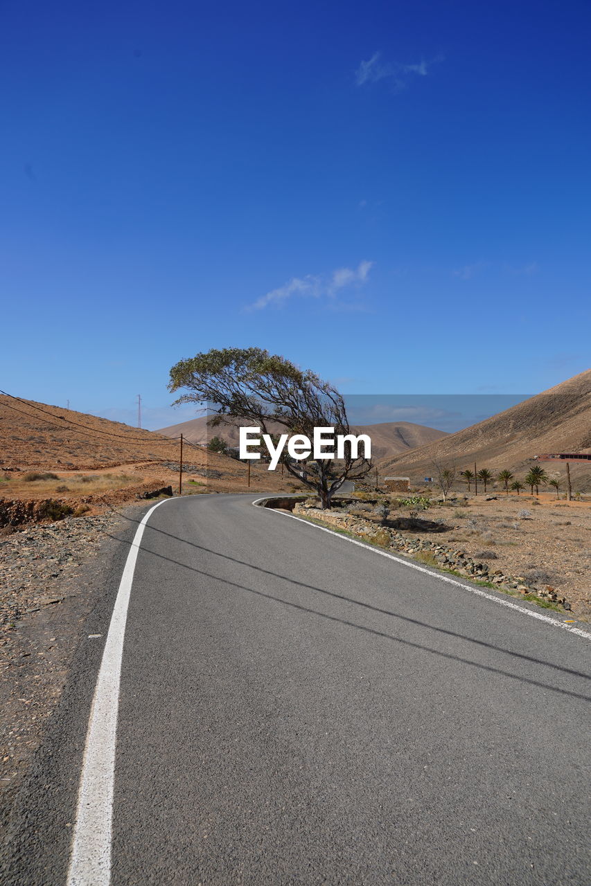 blue, sky, nature, tree, day, reflection, sunlight, no people, transportation, outdoors, plant, land, road, architecture