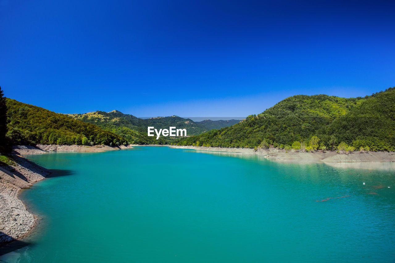 SCENIC VIEW OF SWIMMING POOL AGAINST CLEAR BLUE SKY