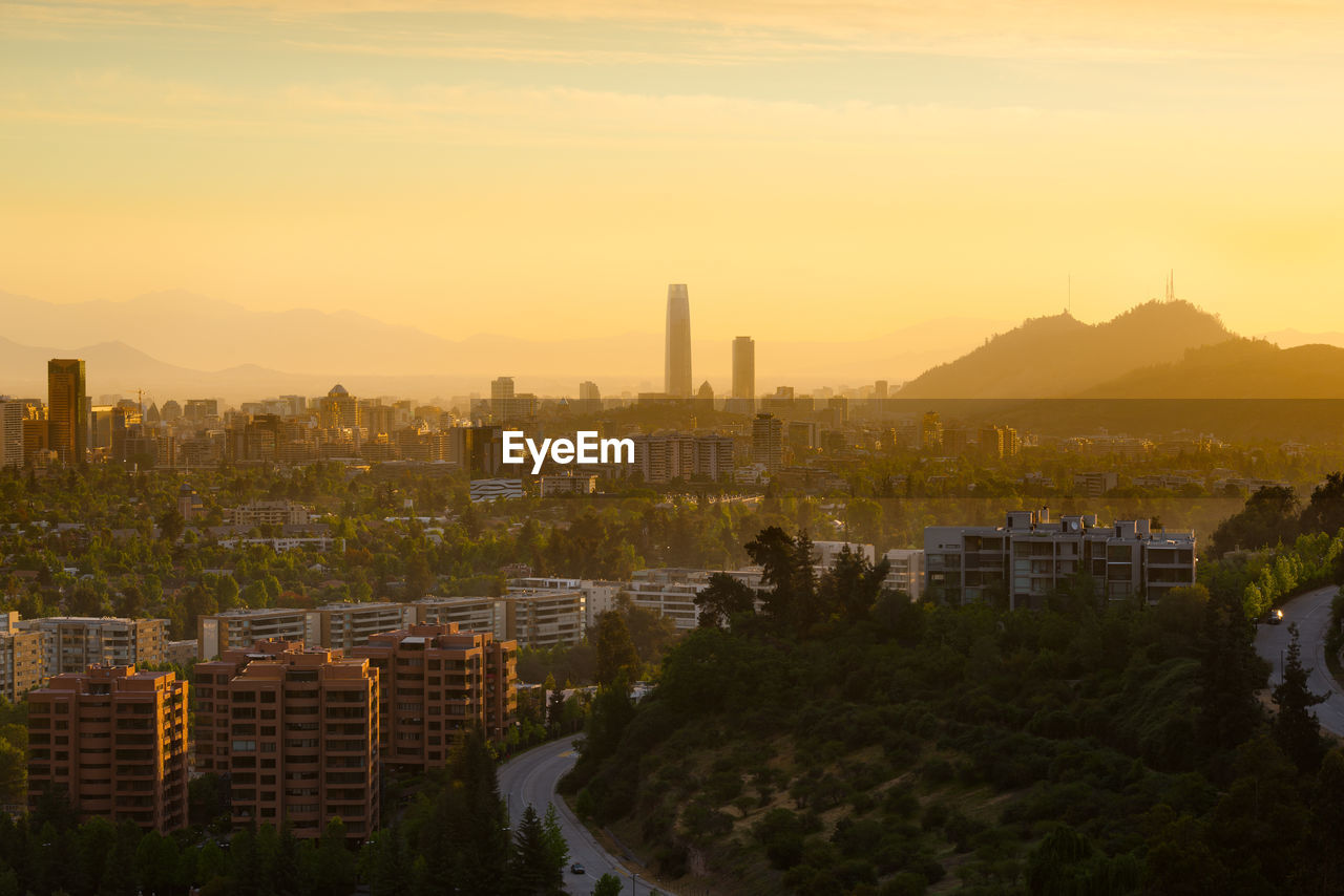 High angle view of city against sky during sunset