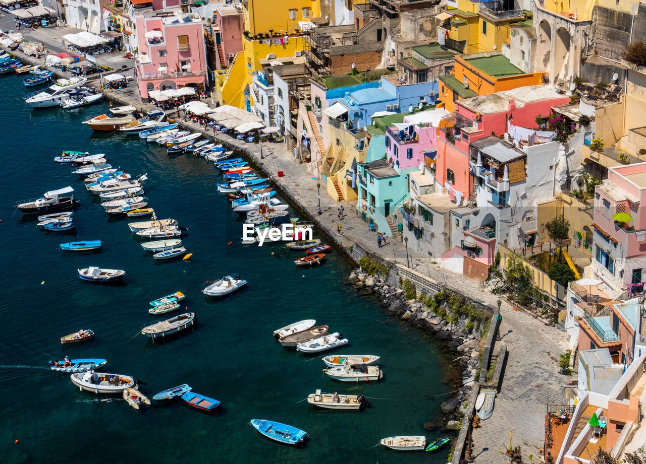 High angle view of boats moored at harbor