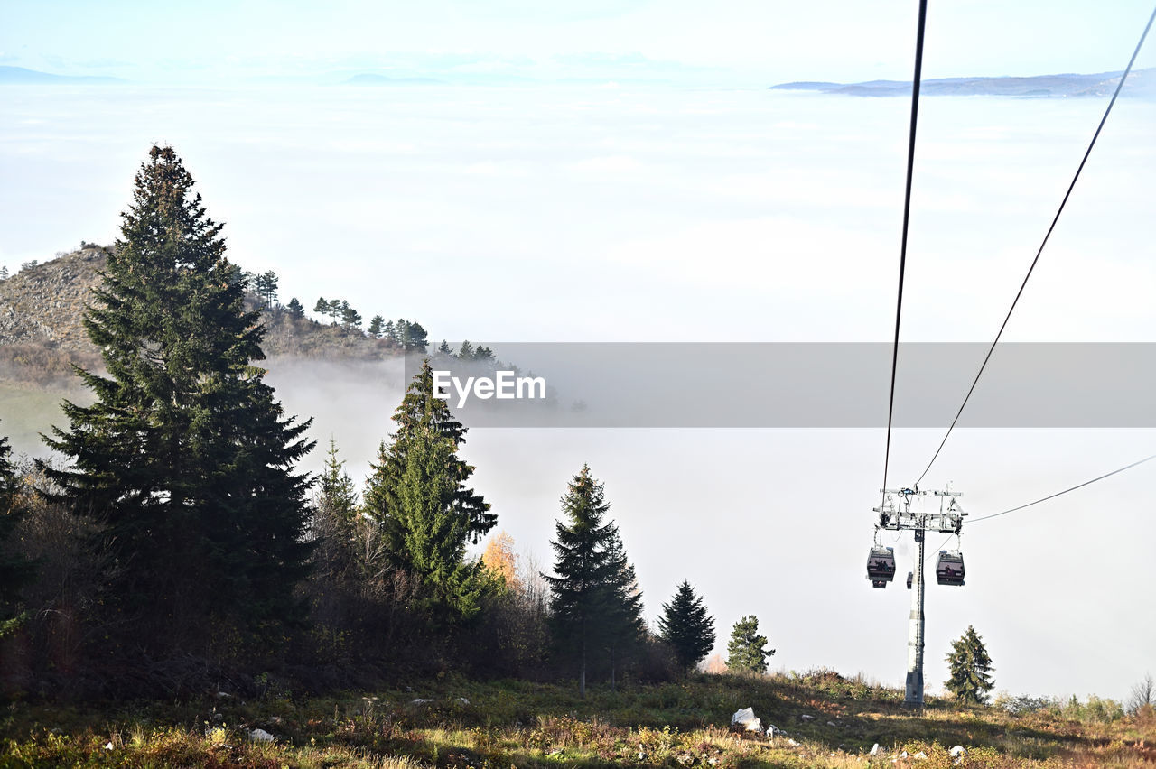 Low angle view of ski lift against sky