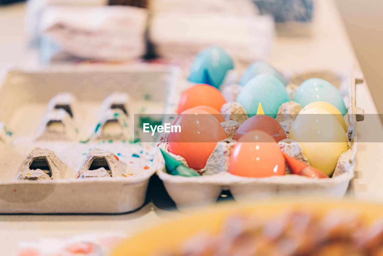 Colorful easter eggs in egg carton