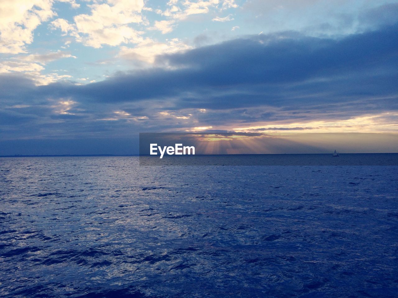 Scenic view of seascape against cloudy sky