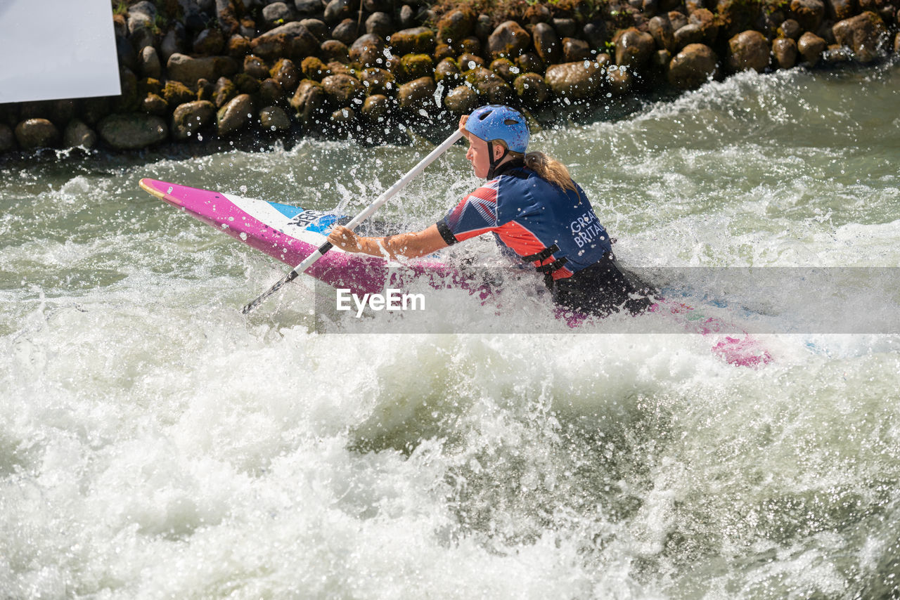 MAN SURFING ON WATER