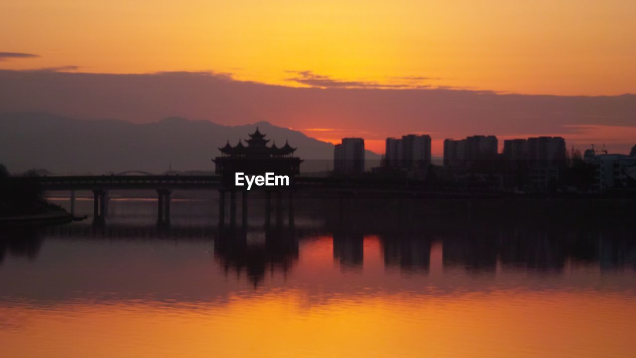 SILHOUETTE OF BUILDING AT SUNSET