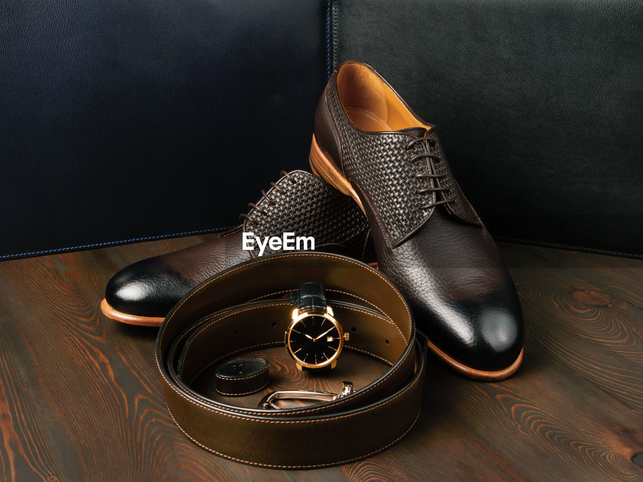 HIGH ANGLE VIEW OF SHOES ON TABLE AT HOME