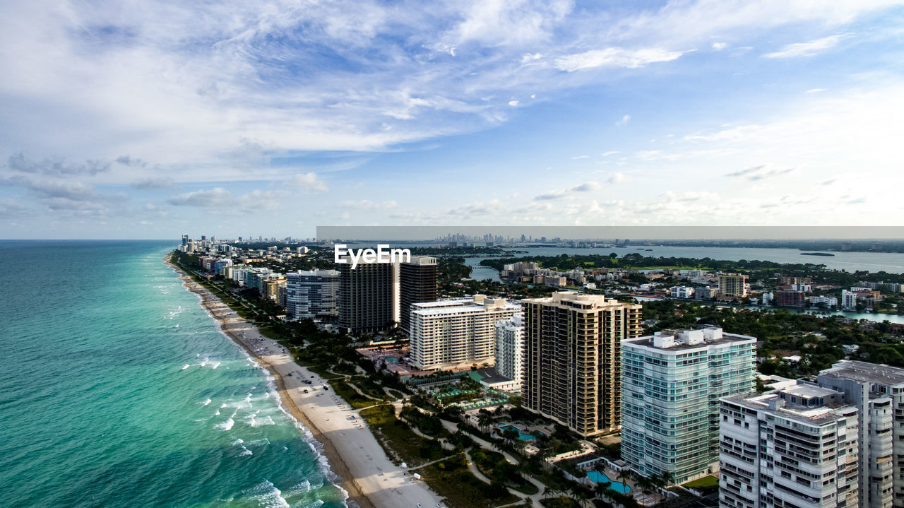 City skyline with sea in background