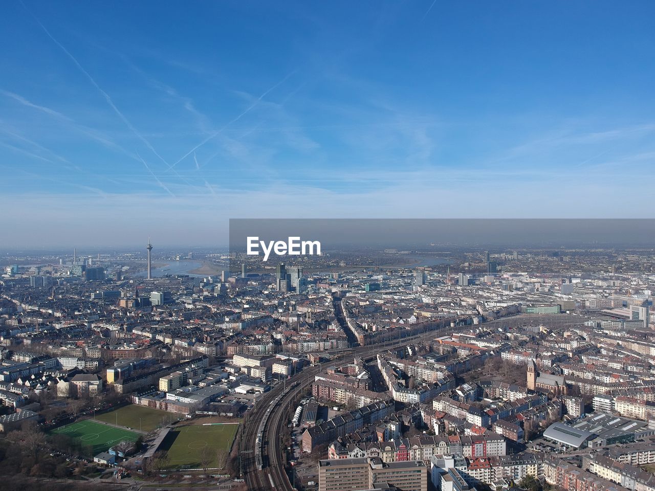 High angle view of city buildings against sky