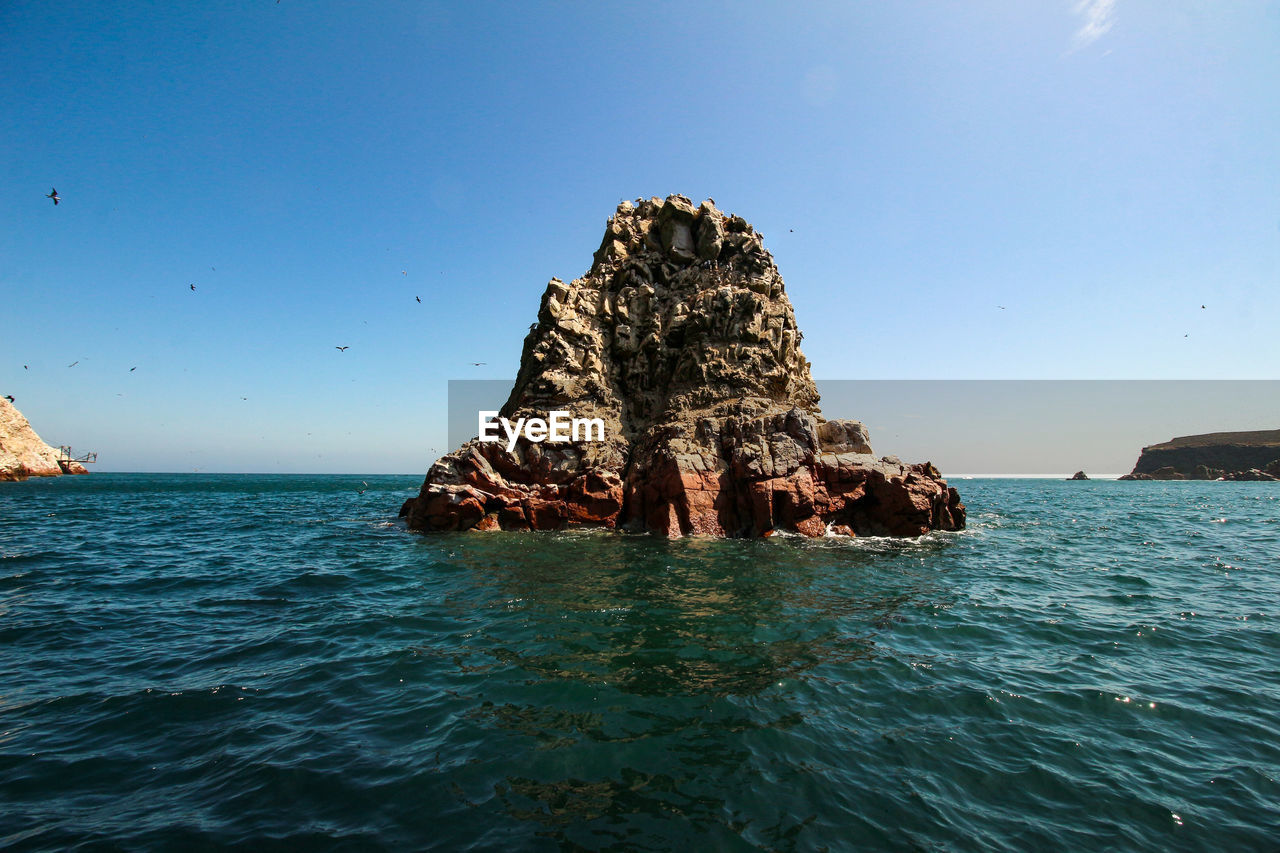 Ballestas islands, paracas, national reserve park. scenic view of sea against sky.