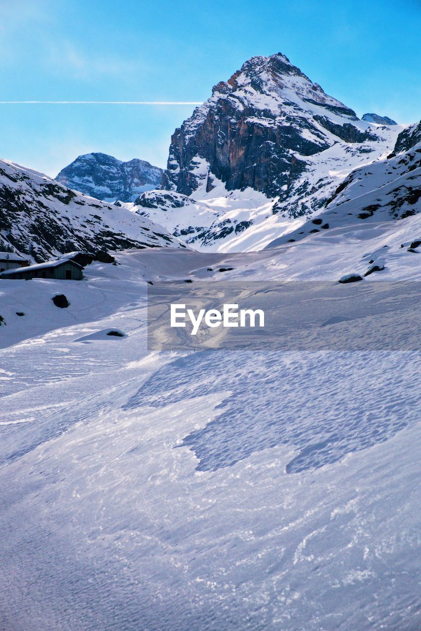 Scenic view of snow mountains against sky