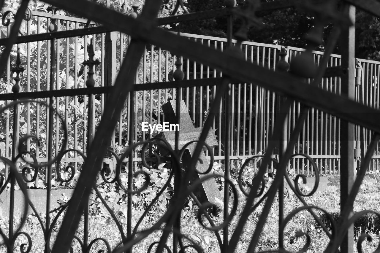 LOW ANGLE VIEW OF METALLIC FENCE