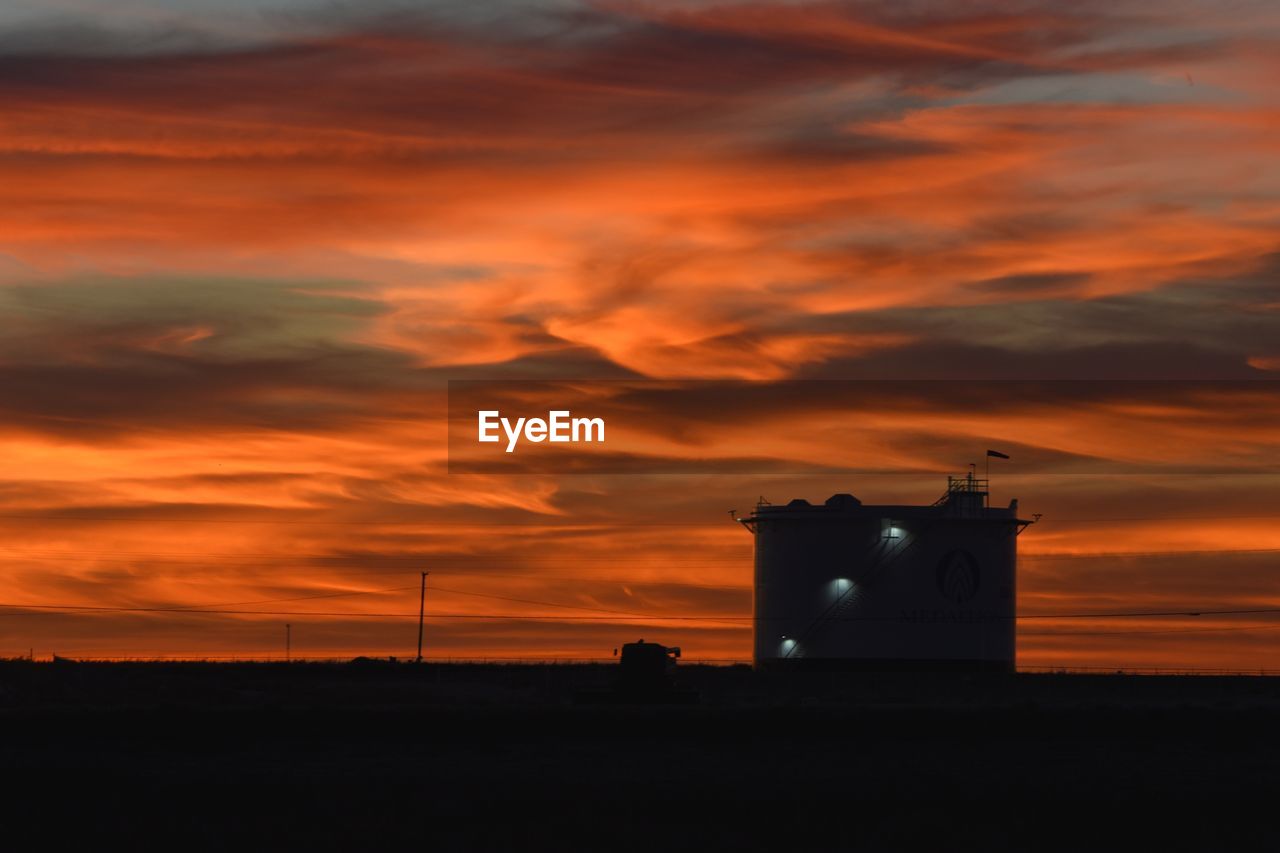 BUILT STRUCTURE AGAINST SKY DURING SUNSET